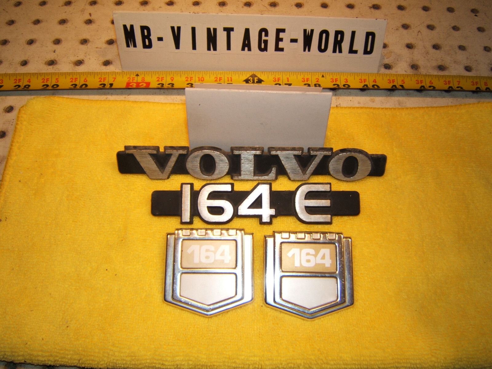 OEM Volvo 1975 164E sedan Fenders sides rear trunk metal OEM 1 set of 4 Emblems