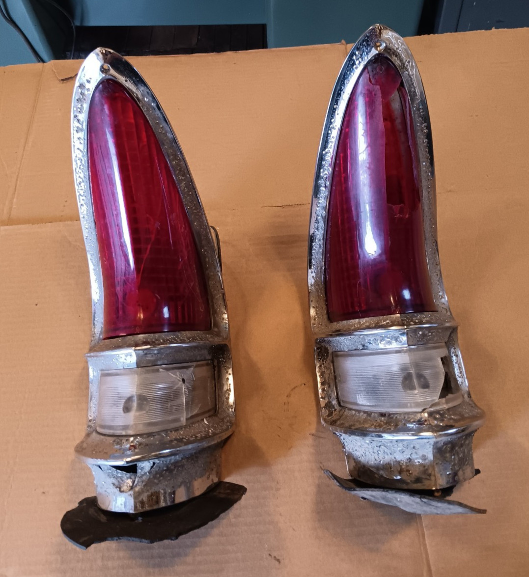 56 57 Packard Clipper tail lights bezels housings rough good ones to cut off